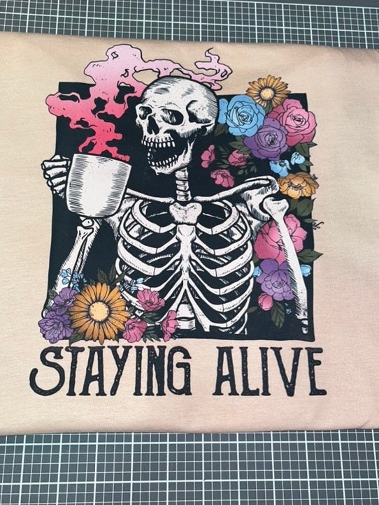 Staying Alive Floral Skeleton Drinking Coffee Tee / Coffee Skeleton T-Shirt - Stitch N Bling
